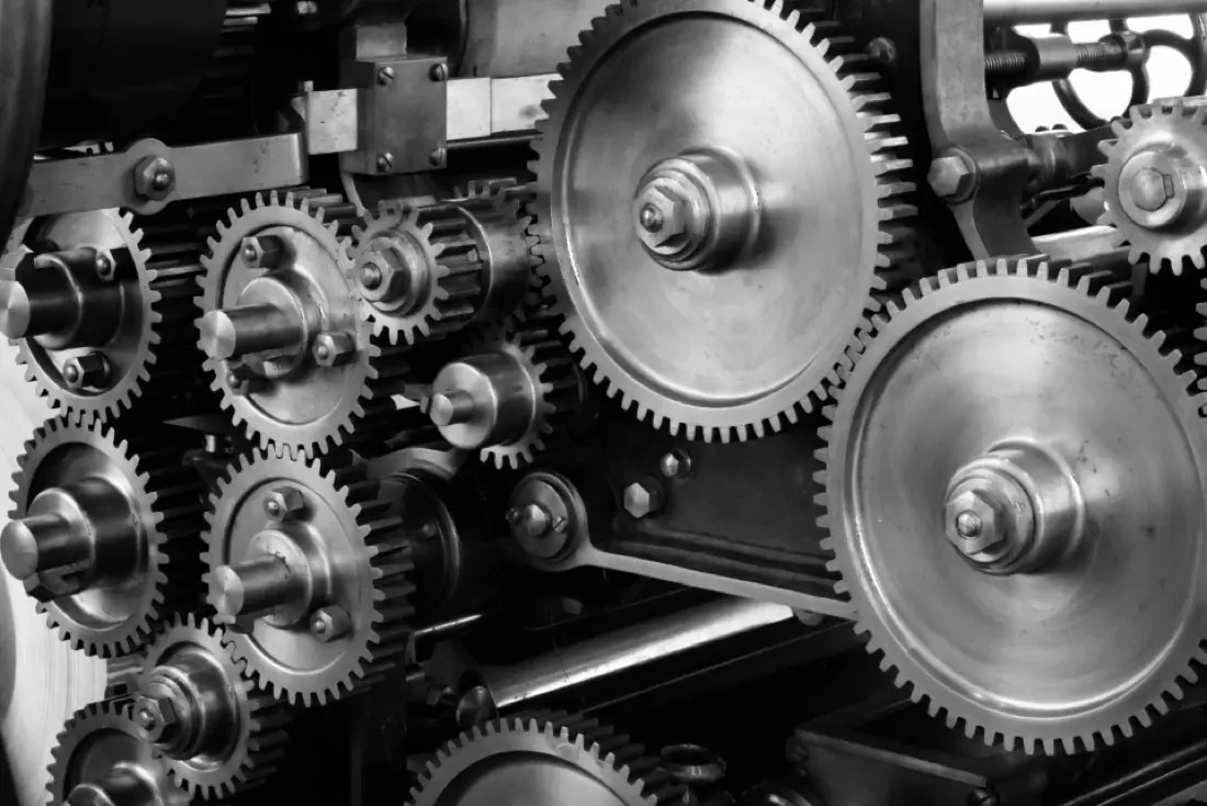 Close-up of interlocking metal gears in an industrial machine