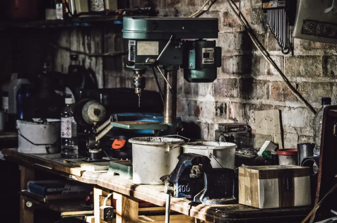Machine workshop with drill press and tools
