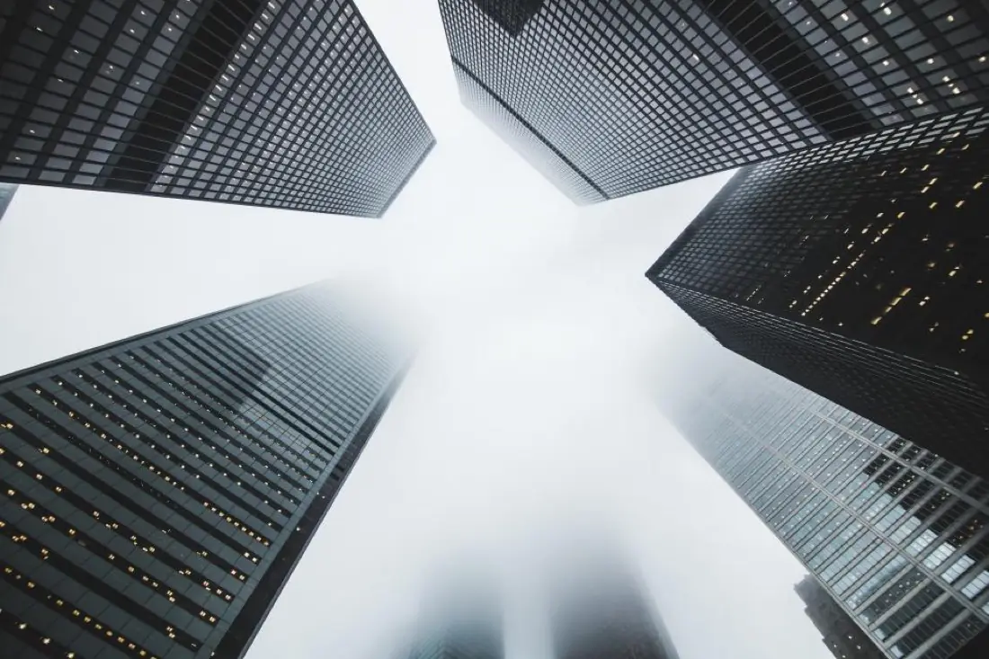 Looking up at glass skyscrapers
